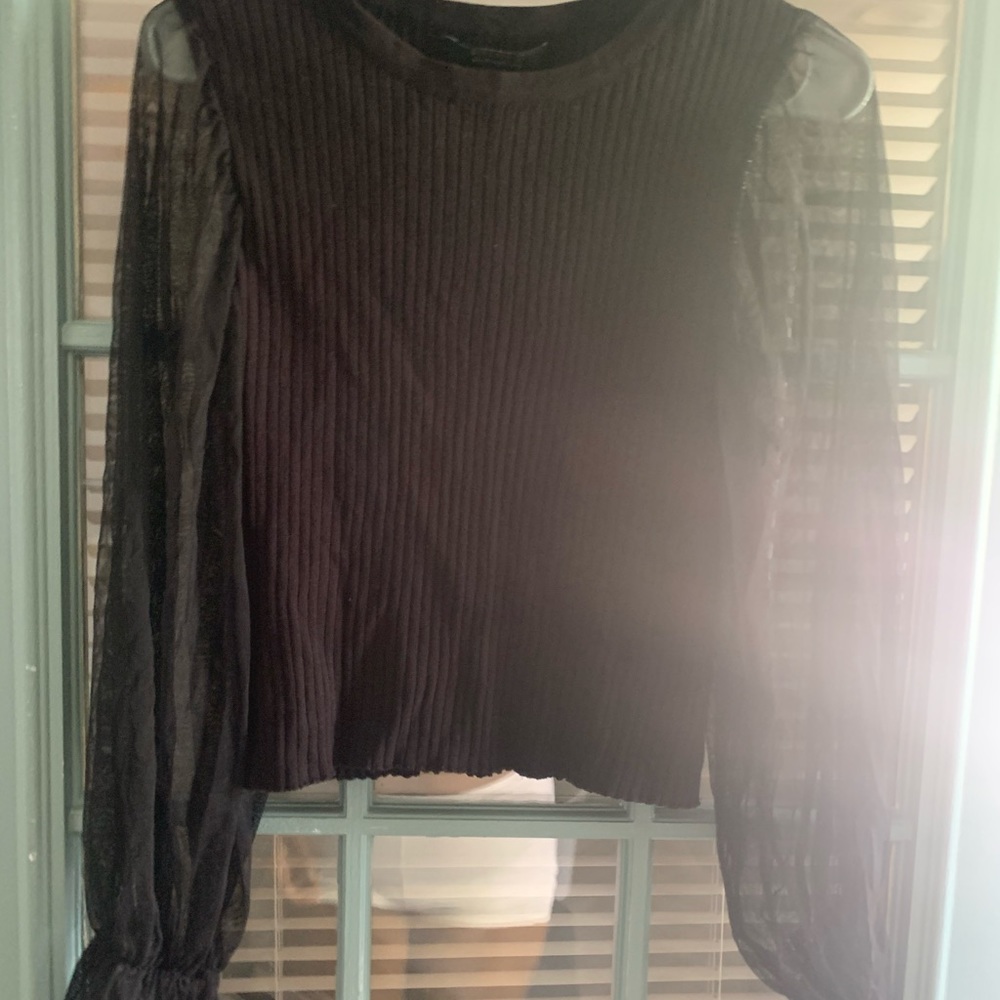 Black sweater with sheer sleeves worn once.